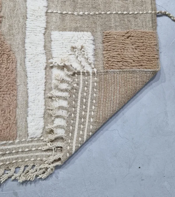 detailed view of Earth tone striped Moroccan rug in beige, taupe, and ivory