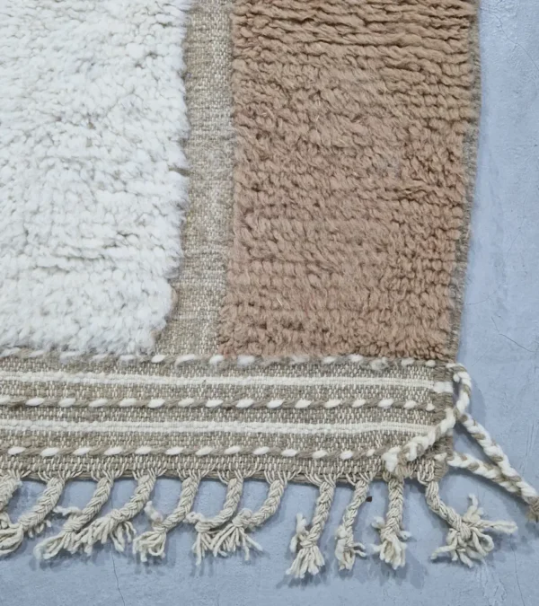 detailed view of Earth tone striped Moroccan rug in beige, taupe, and ivory