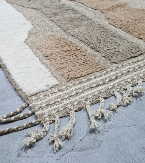detailed view of Earth tone striped Moroccan rug in beige, taupe, and ivory