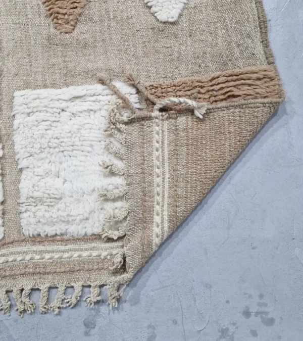detailed view of Handmade Moroccan high/low pile rug with abstract neutral pattern