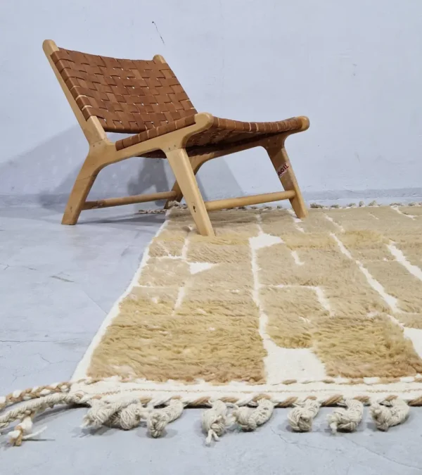 Golden brown geometric Moroccan rug with creamy off-white wool background in room