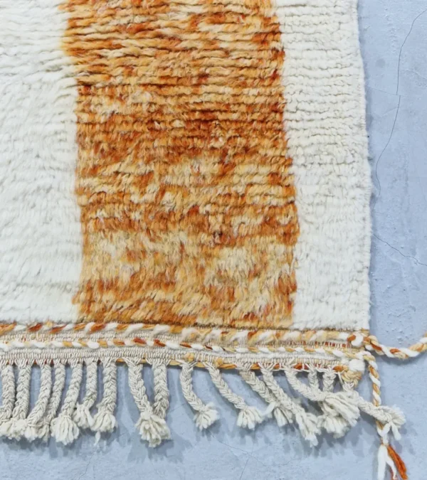 detailed view of Golden Horizon Moroccan rug with golden yellow and off-white abstract shapes