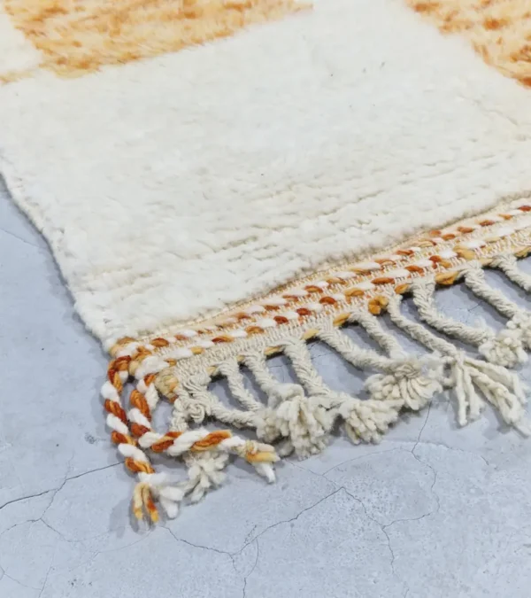 detailed view of Golden Horizon Moroccan rug with golden yellow and off-white abstract shapes