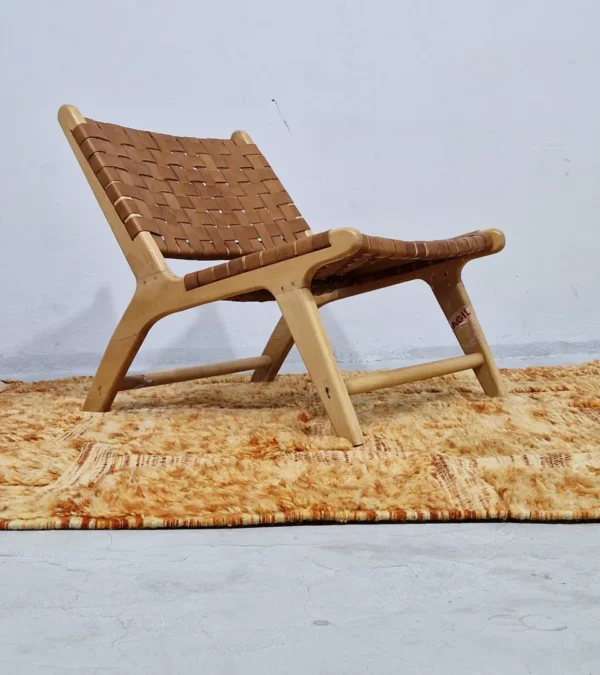 Goldenrod wool rug with plush high-pile texture and beige geometric grid pattern in room