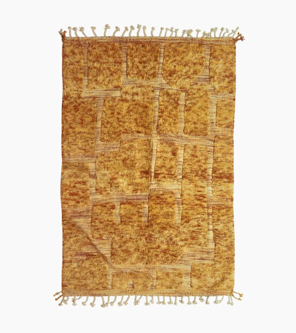 top view of Goldenrod wool rug with plush high-pile texture and beige geometric grid pattern