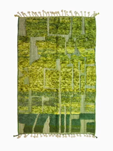 top view of Hand-knotted Moroccan rug with sculpted high-pile texture, variegated green tones, and dual-pattern design with tassels