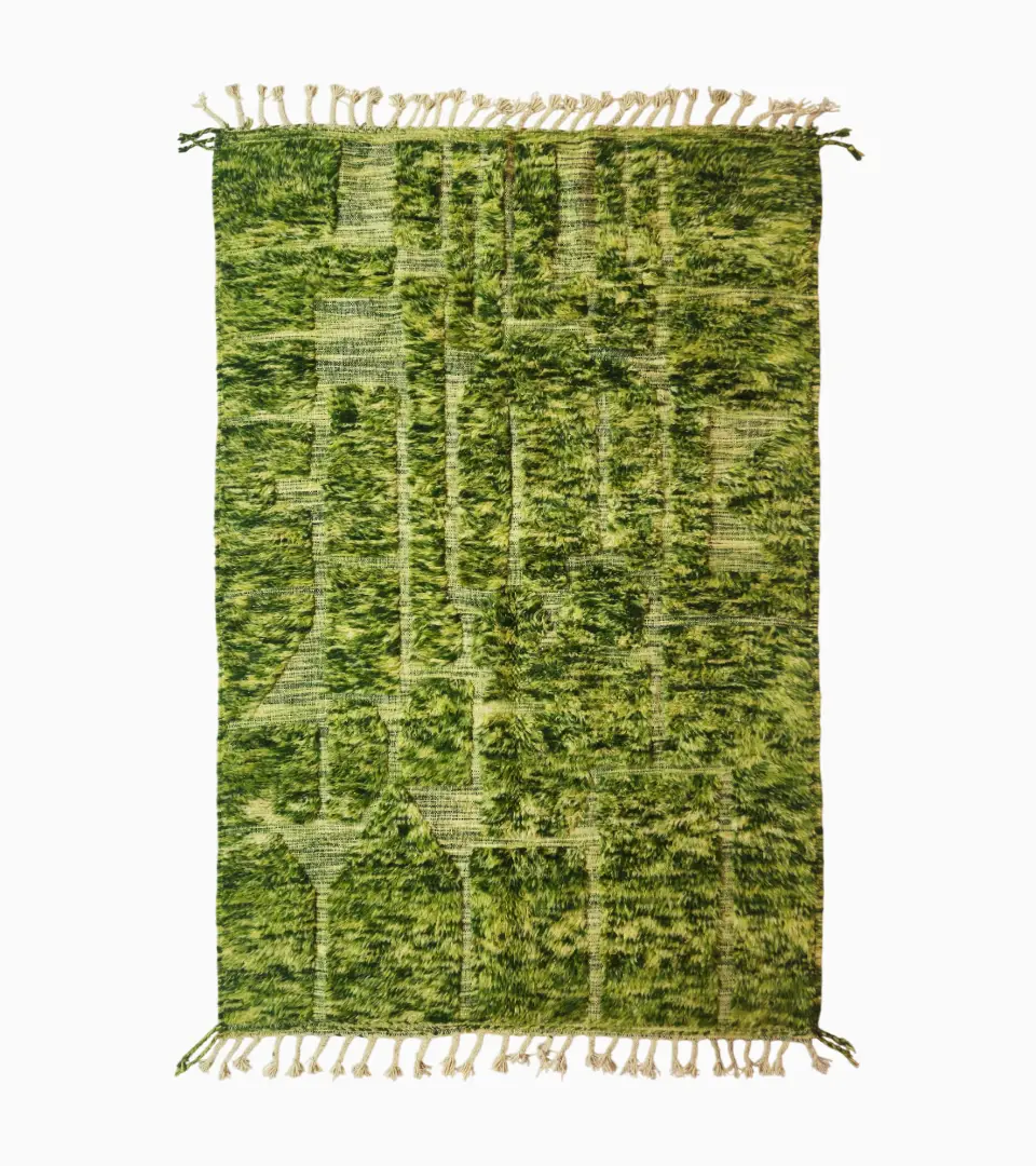 top view of Handcrafted Moroccan shaggy rug with green sculpted design, central square motif, and tassels