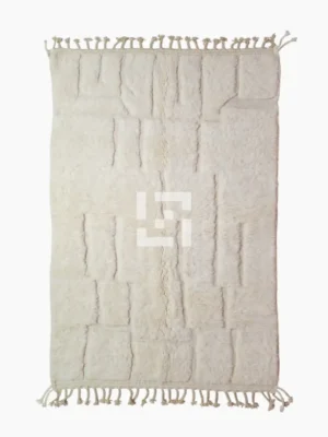top view of Handcrafted ivory Moroccan rug with sculpted high-low grid design and fringe tassels