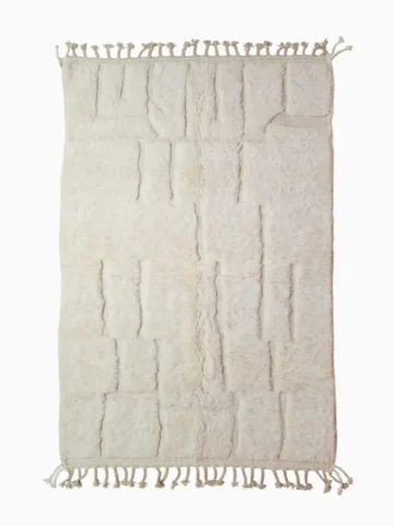 top view of Handcrafted ivory Moroccan rug with sculpted high-low grid design and fringe tassels