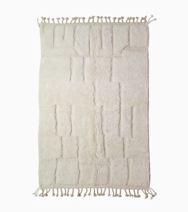 top view of Handcrafted ivory Moroccan rug with sculpted high-low grid design and fringe tassels