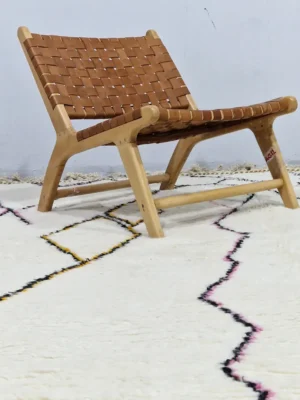 Handmade minimalist Moroccan wool rug with colorful abstract lines on a high pile in room