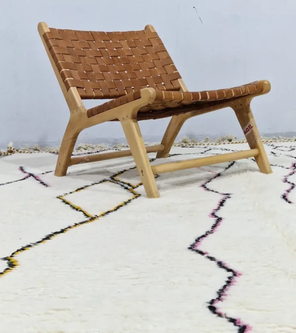 Handmade minimalist Moroccan wool rug with colorful abstract lines on a high pile in room