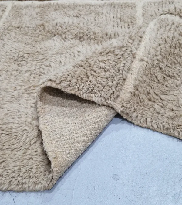detailed view of Handmade Moroccan high/low pile rug with taupe geometric pattern