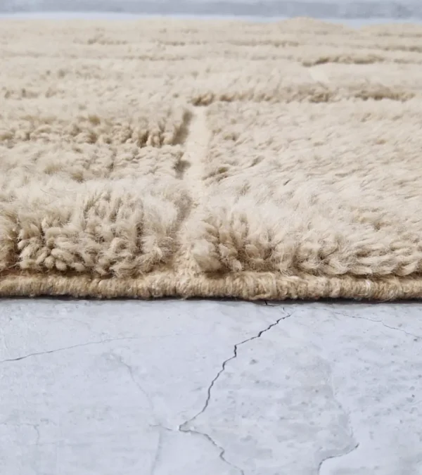 zoomed in view of Handmade Moroccan high/low pile rug with taupe geometric pattern