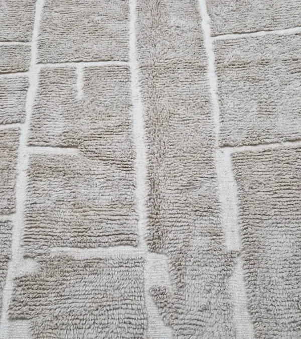 detailed view of Handmade Moroccan high/low pile rug with taupe geometric pattern