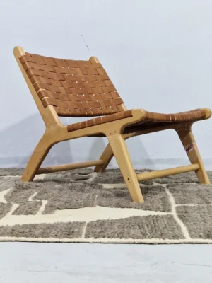 Neutral modern geometric wool rug with muted brown and cream high-low pile design in room