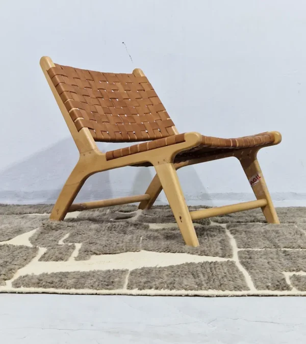 Neutral modern geometric wool rug with muted brown and cream high-low pile design in room