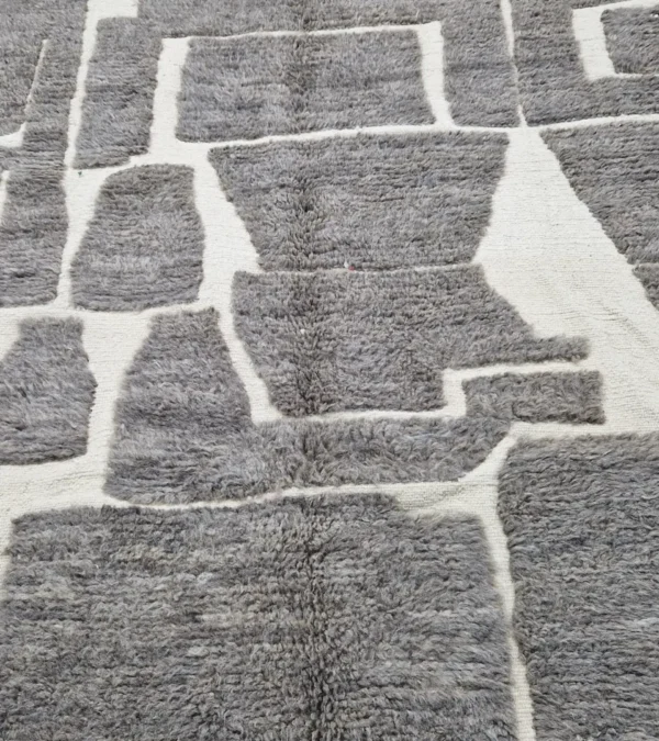 detailed view of Neutral modern geometric wool rug with muted brown and cream high-low pile design