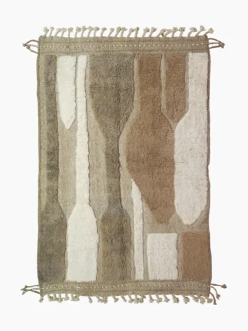 top view of Handcrafted Moroccan rug with sculpted high-low abstract neutral design and tassels