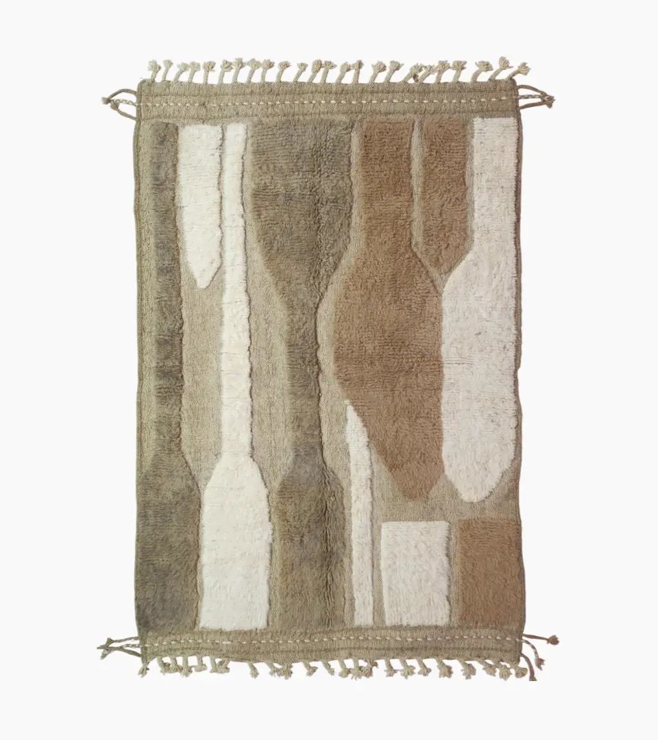 top view of Handcrafted Moroccan rug with sculpted high-low abstract neutral design and tassels