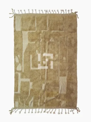 top view of Handmade Moroccan wool rug in sandy beige with sculpted off-white linework and tassels