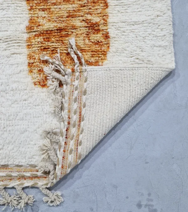 detailed view of Custom size Moroccan rug with tassels, rust and beige modern design