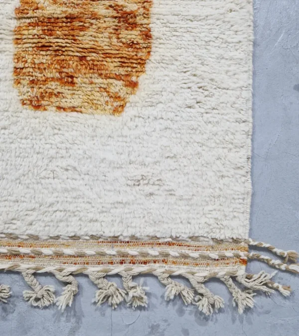detailed view of Custom size Moroccan rug with tassels, rust and beige modern design