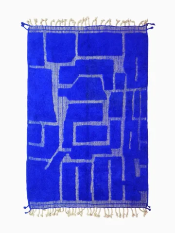 top view of Handmade Moroccan rug with bold blue base and sculpted geometric grid