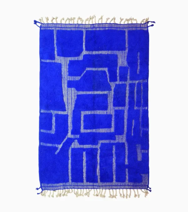 top view of Handmade Moroccan rug with bold blue base and sculpted geometric grid