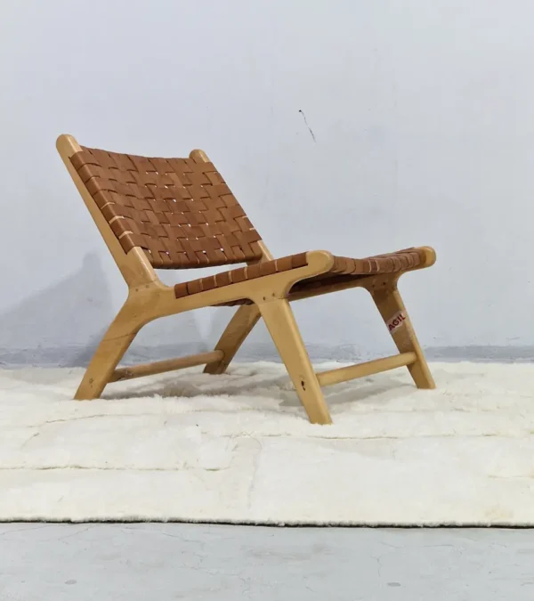 Handwoven cream wool rug with sculpted high-low pile geometric pattern in room