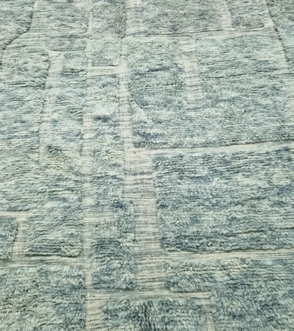 detailed view of Modern Moroccan rug in muted blue-gray tones with geometric design