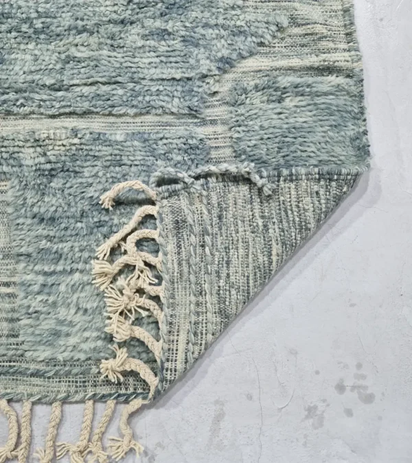 detailed view of Modern Moroccan rug in muted blue-gray tones with geometric design