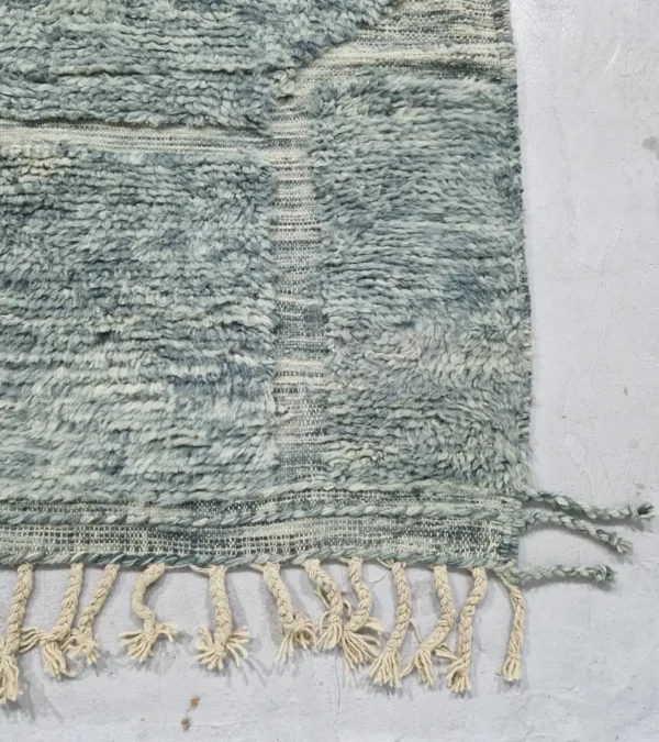 detailed view of Modern Moroccan rug in muted blue-gray tones with geometric design