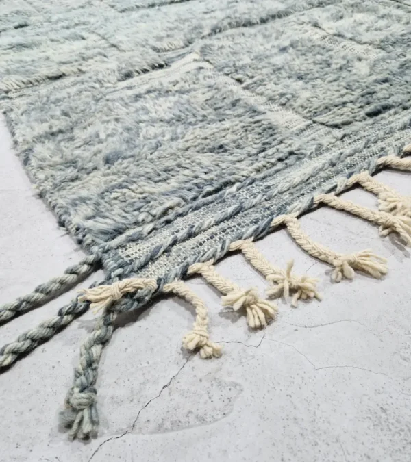 detailed view of Modern Moroccan rug in muted blue-gray tones with geometric design