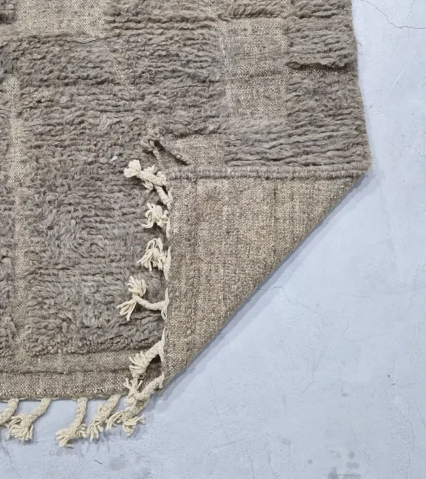 detailed view of Stone gray Moroccan rug with sculpted geometric grid pattern