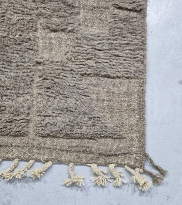 detailed view of Stone gray Moroccan rug with sculpted geometric grid pattern