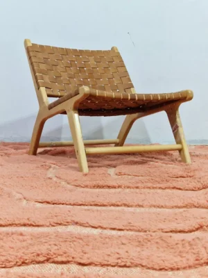 Hand knotted Moroccan terracotta wool rug with high-low geometric pyramid design in room