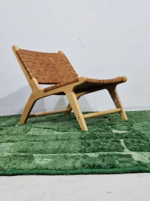 Hand-knotted Moroccan wool rug with high-low geometric grid in green and off-white tones in room
