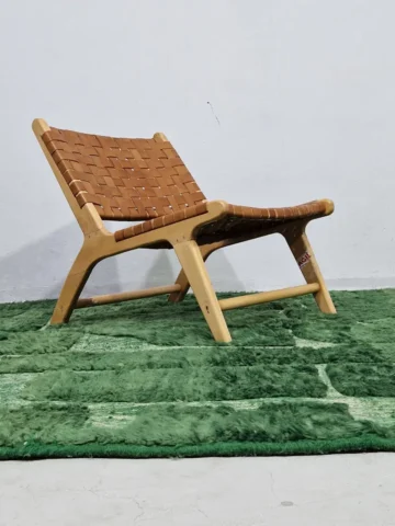 Hand-knotted Moroccan wool rug with high-low geometric grid in green and off-white tones in room