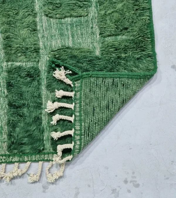 detailed view of Hand-knotted Moroccan wool rug with high-low geometric grid in green and off-white tones