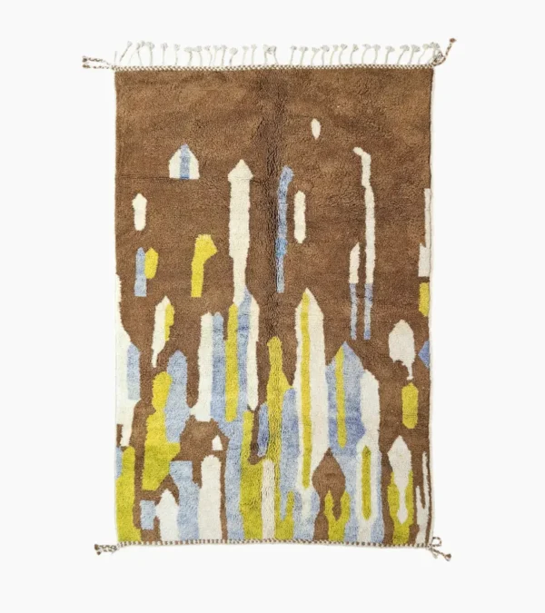 Top View of Zola Beni Ourain Hand-knotted wool rug with an abstract design of vertical white, blue, and green shapes on a brown background