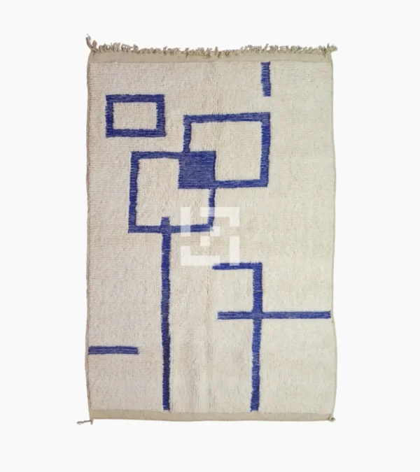Top View of Zola handmade Beni Ourain wool rug with a minimalist geometric design of royal blue lines and shapes on an ivory background