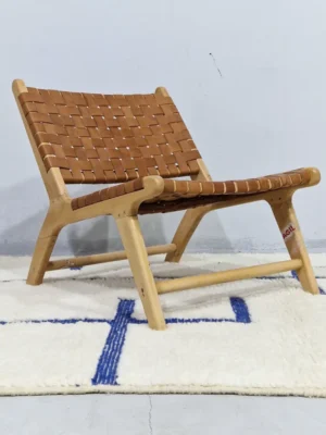 Zola handmade Beni Ourain wool rug with a minimalist geometric design of royal blue lines and shapes on an ivory background in room