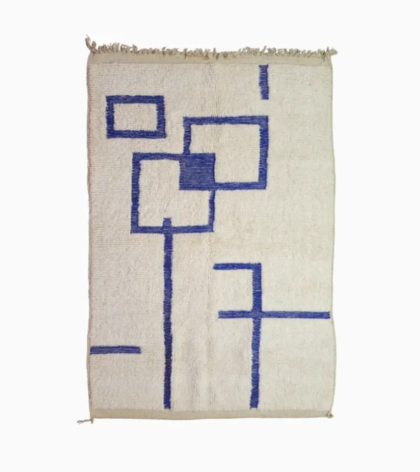 Top View of Zola handmade Beni Ourain wool rug with a minimalist geometric design of royal blue lines and shapes on an ivory background