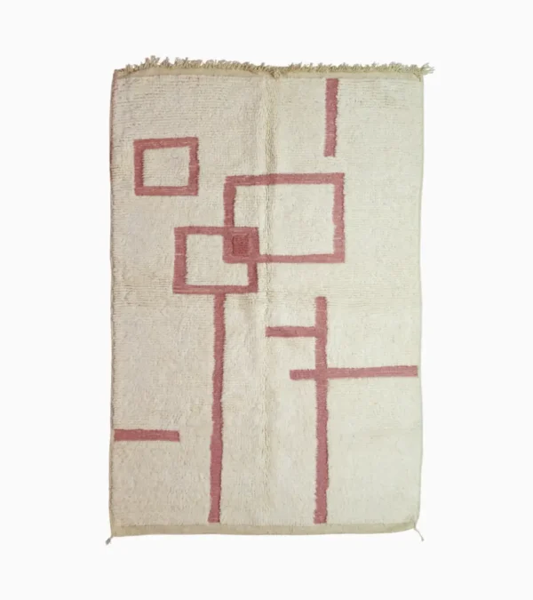 top view of Zola handmade Beni Ourain wool rug with a minimalist geometric design of pink lines and shapes on an ivory background
