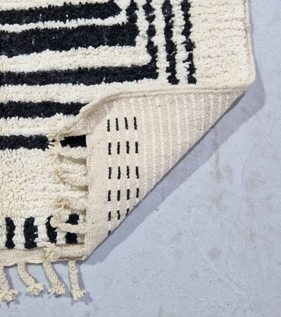 Contemporary graphic wool rug with tassels