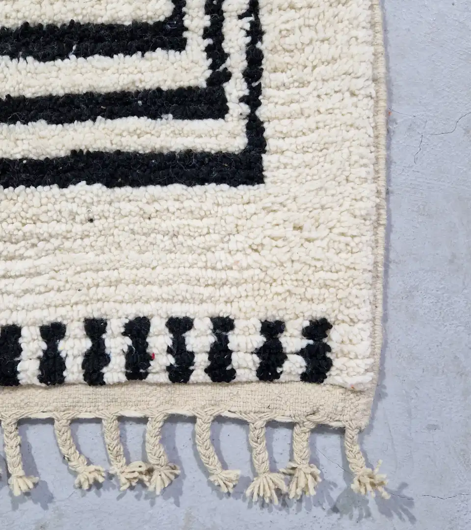 Contemporary graphic wool rug with tassels