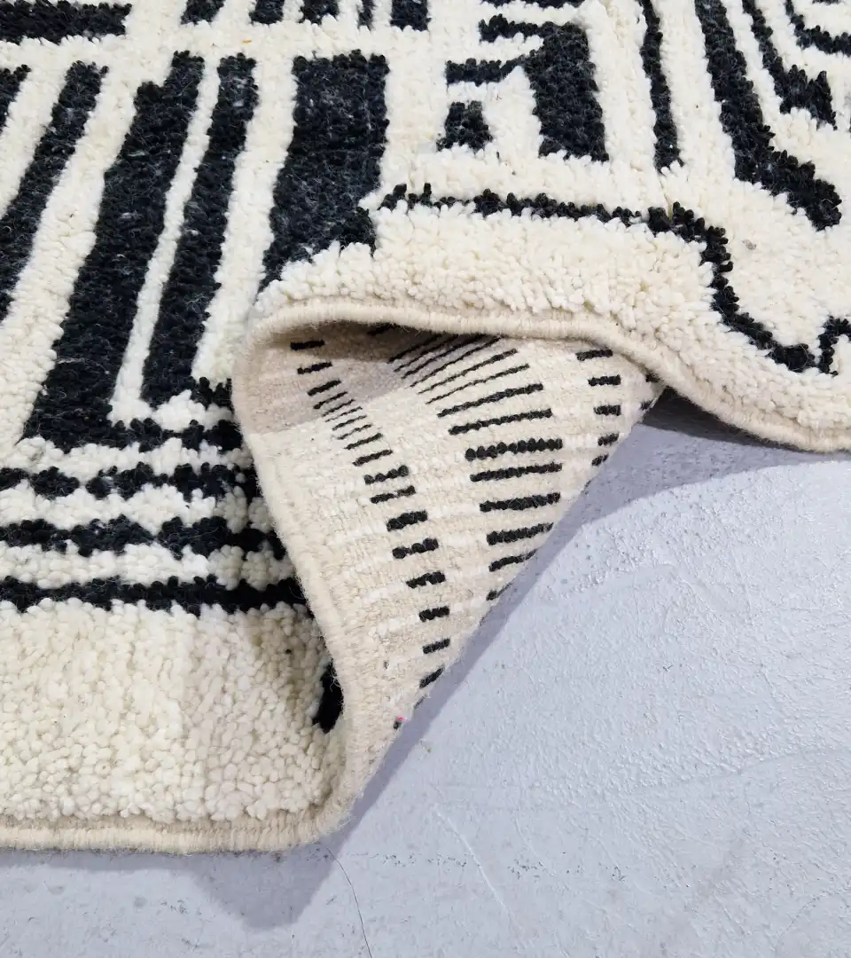 Minimalist black and white geometric wool rug