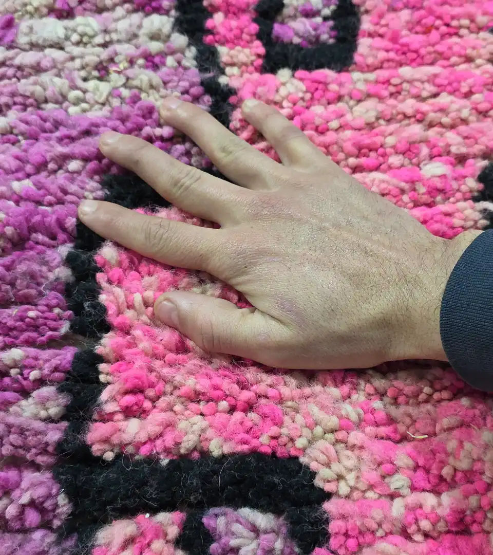 Artisan hand knotted wool rug in pink tones