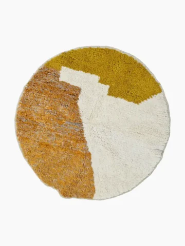 Hand knotted wool round rug 4ft in ivory and mustard